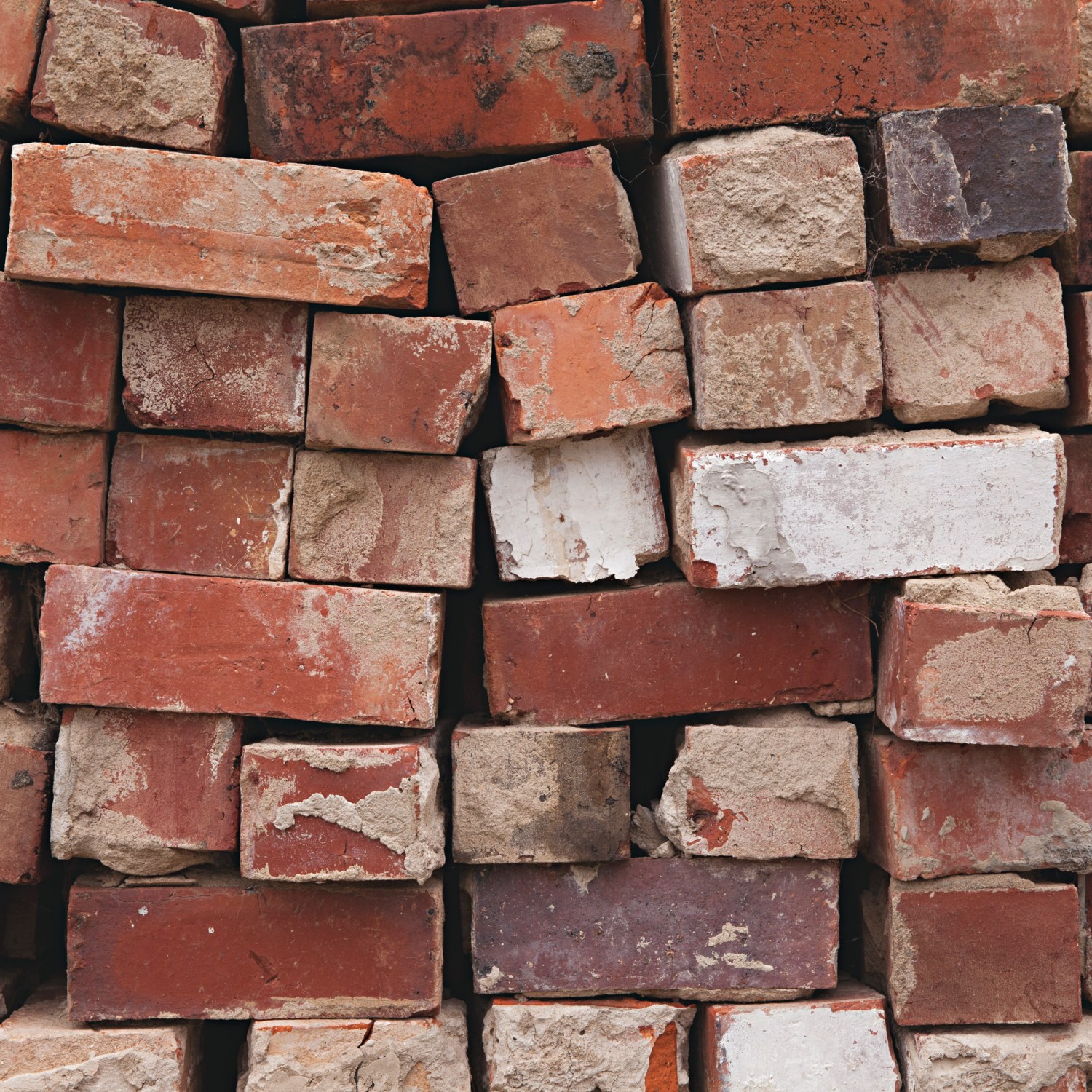 Stack of weathered red bricks