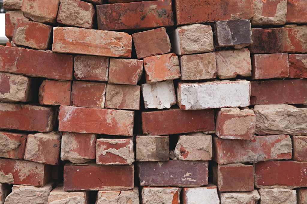 Stack of weathered red bricks