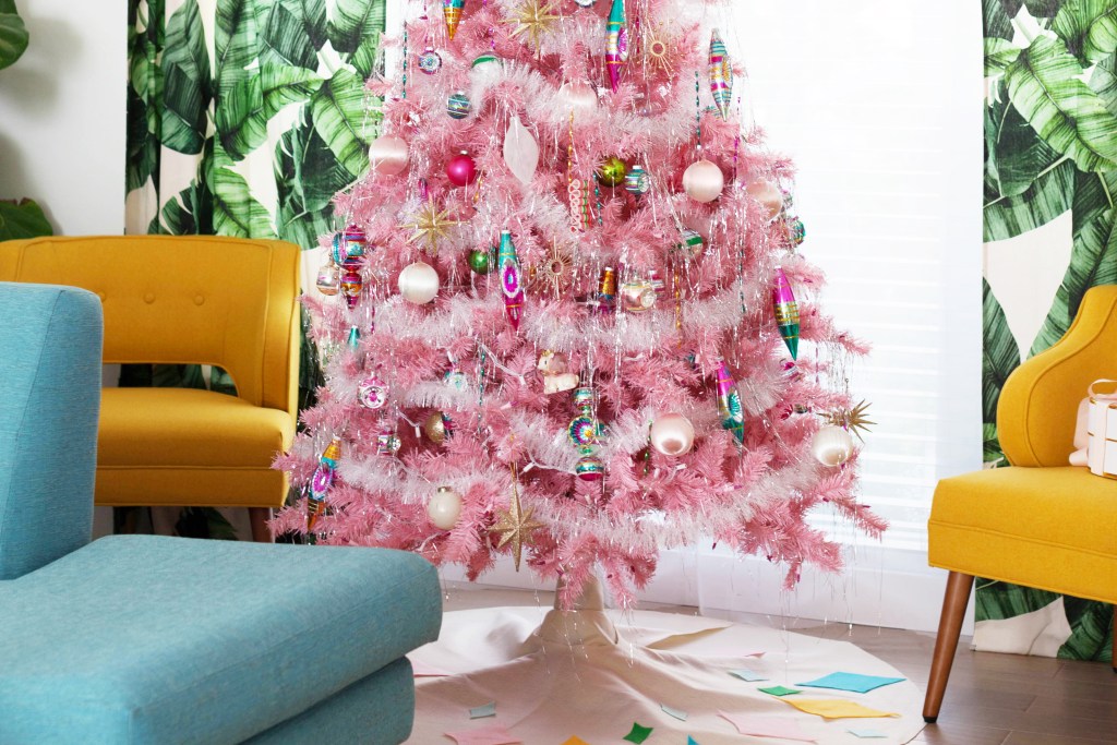 Pink aluminum Christmas tree in retro living room