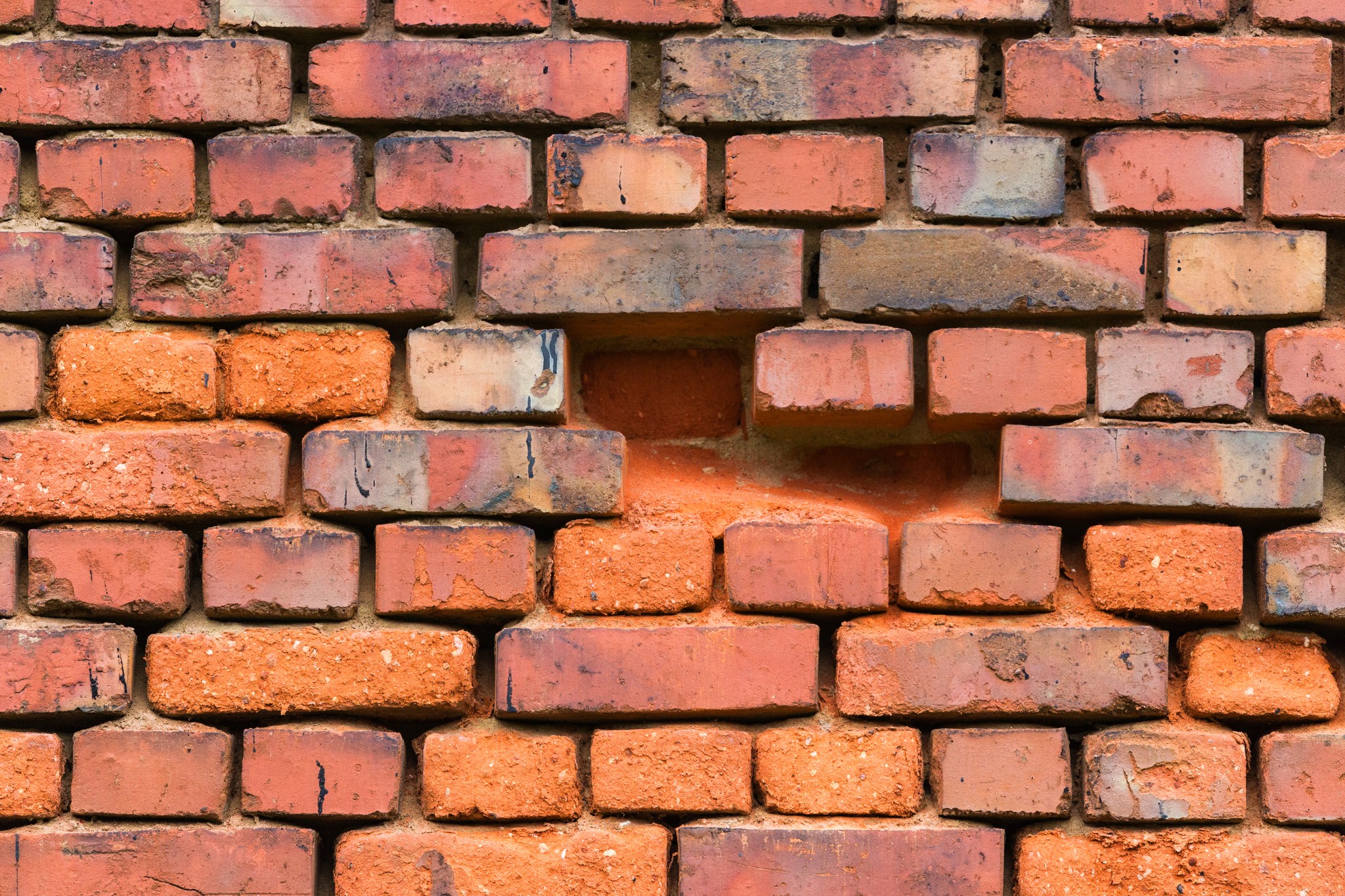 Red brick wall with four bricks missing | Home Equity Loans