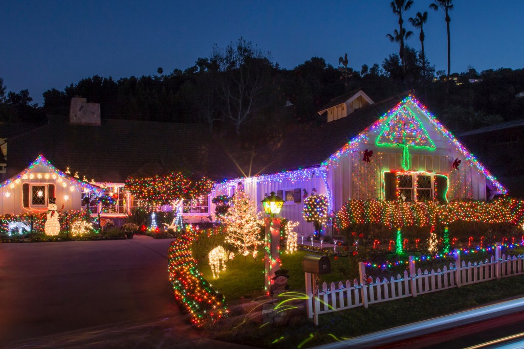 Brightly colored Christmas light display outside a home