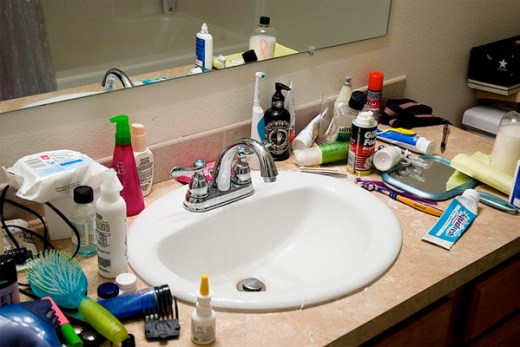 A cluttered bathroom sink