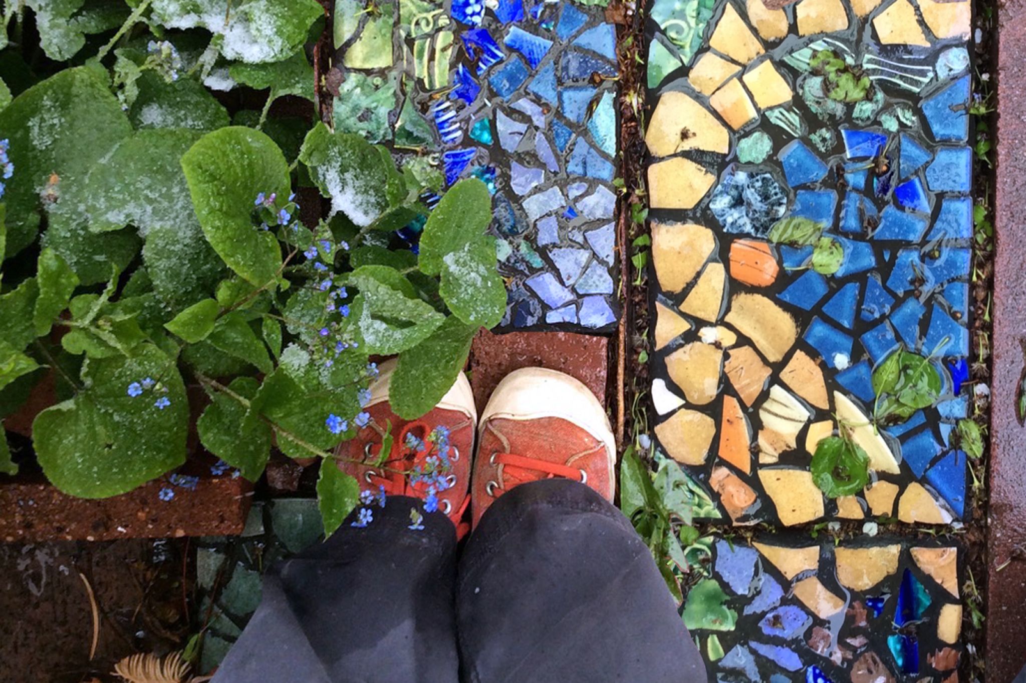 Kid standing next to a DIY stepping stone