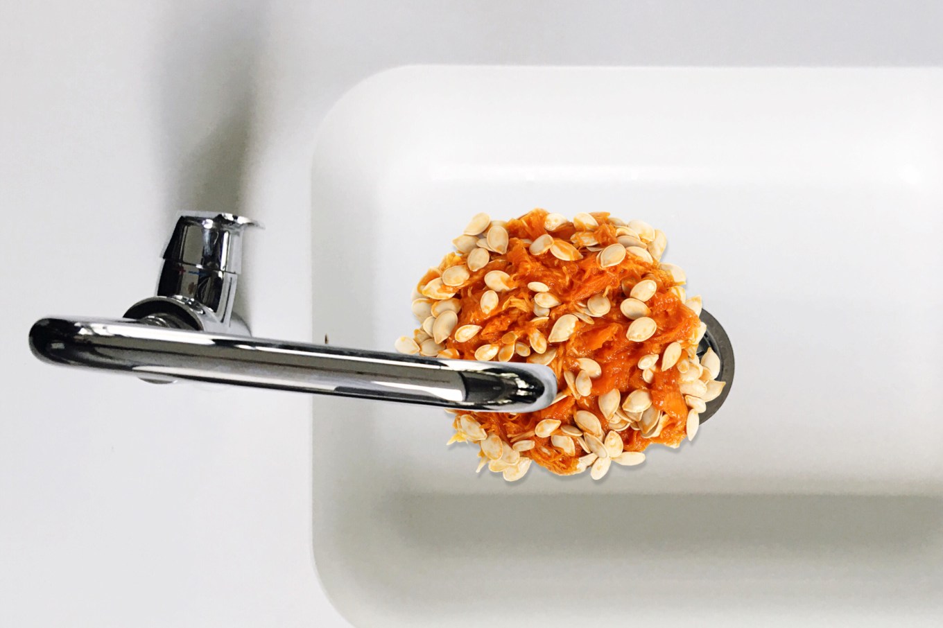 Pumpkin pulp in a kitchen sink