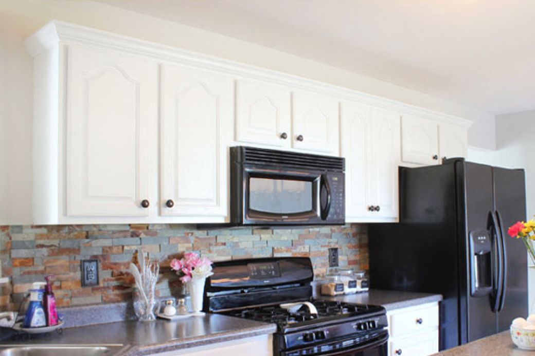 Kitchen with white painted cabinets