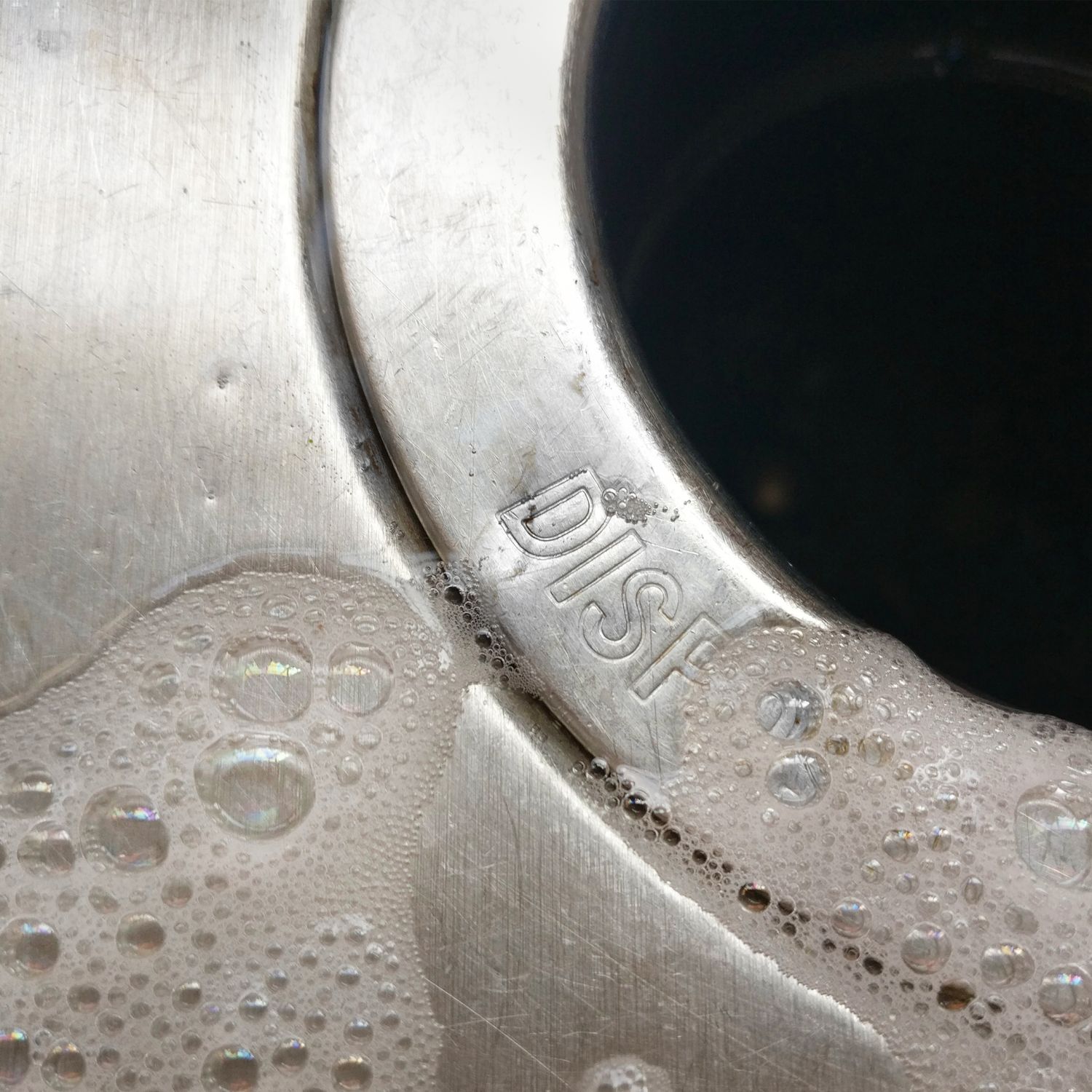 Closeup of a garbage disposal in a kitchen sink