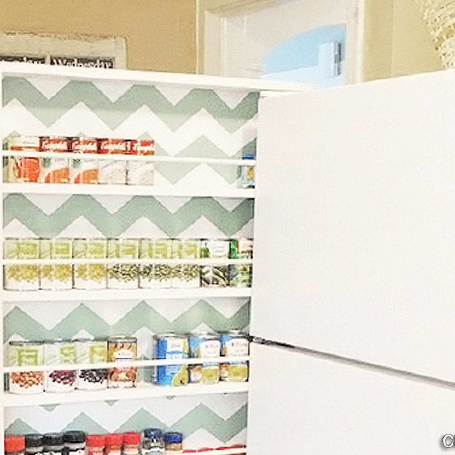 Space-saving can storage next to refrigerator