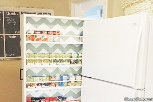 Space-saving can storage next to refrigerator