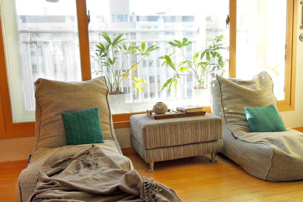 Comfortable chairs in front of a window in an apartment
