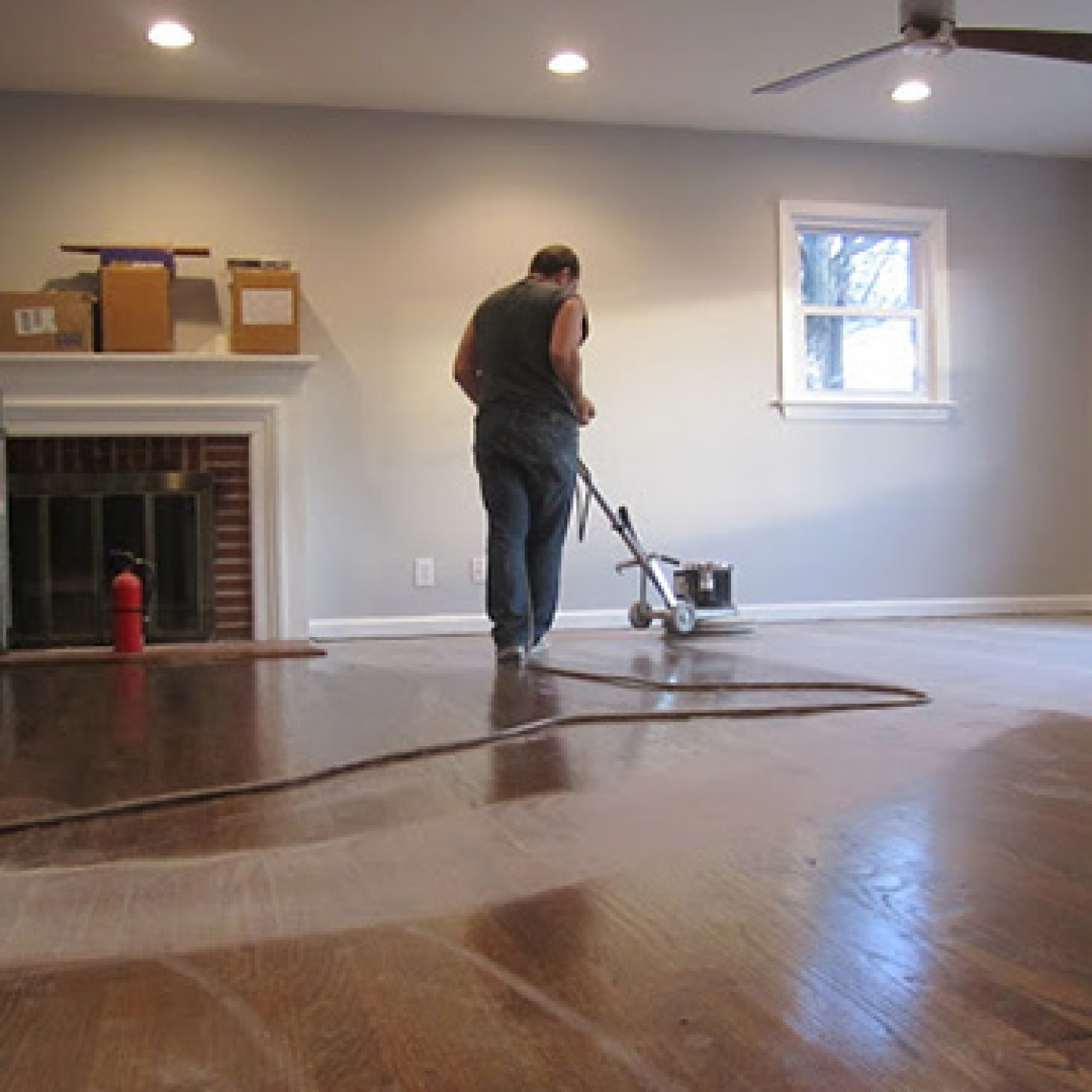 A pro refinishing hardwood floors