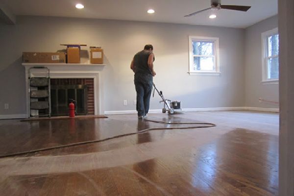 A pro refinishing hardwood floors