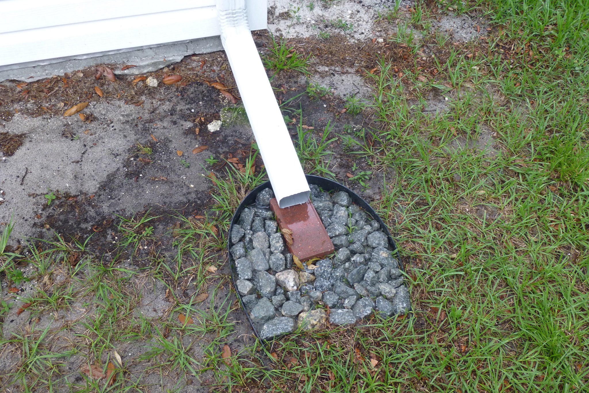 Proper downspout drainage for a house