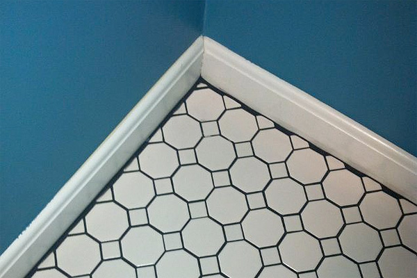 Tile Grout Showing at Baseboards | Bad Remodeling Jobs