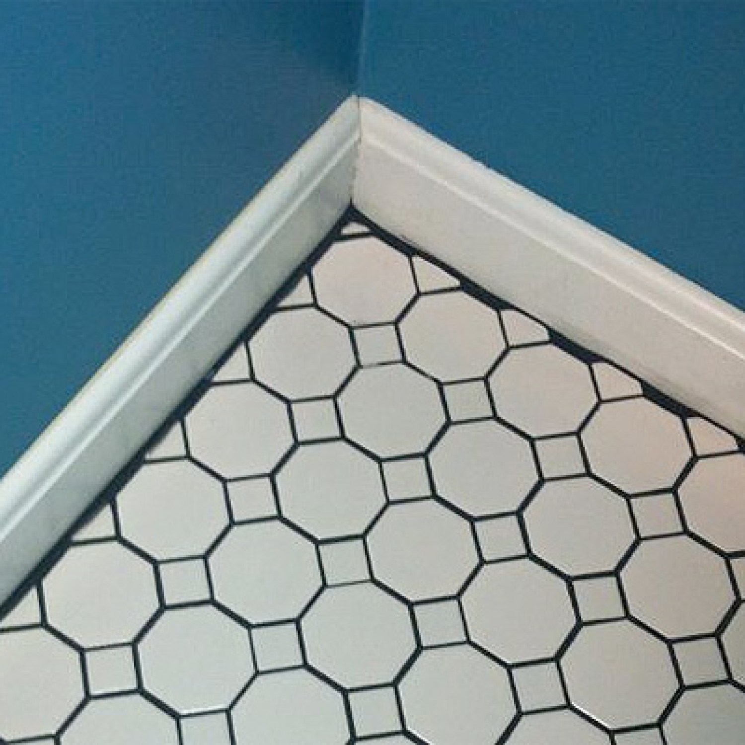 Tile Grout Showing at Baseboards | Bad Remodeling Jobs