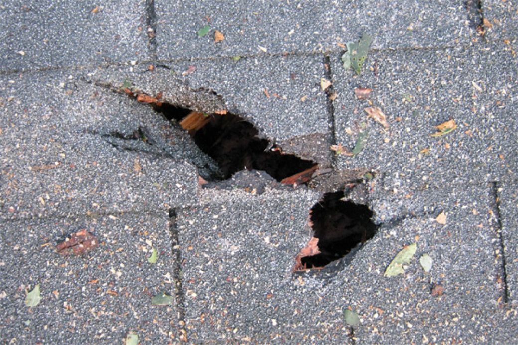 Hole in a roof due to storm damage