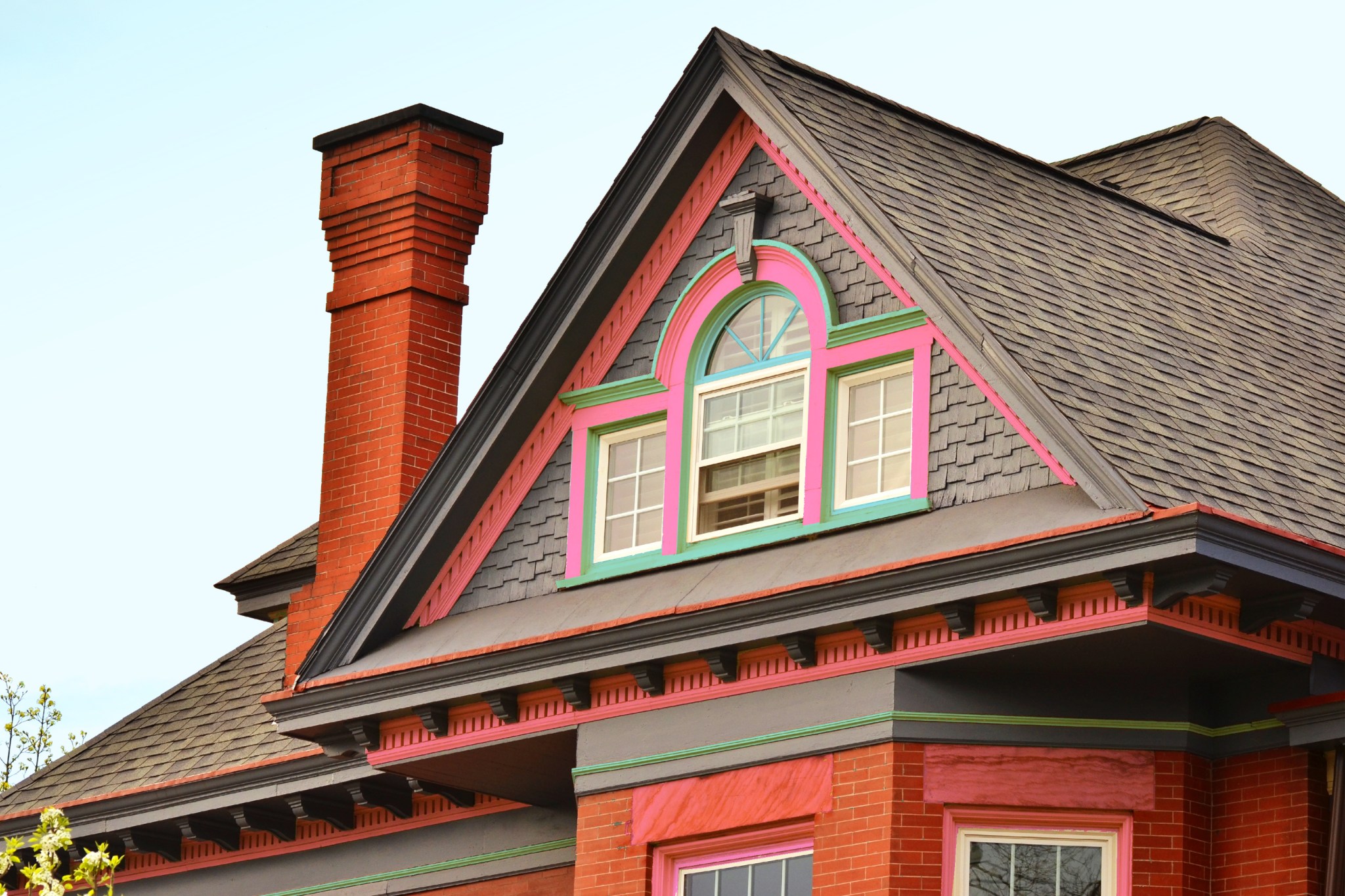 Brand new roof on house with pink and green detailing