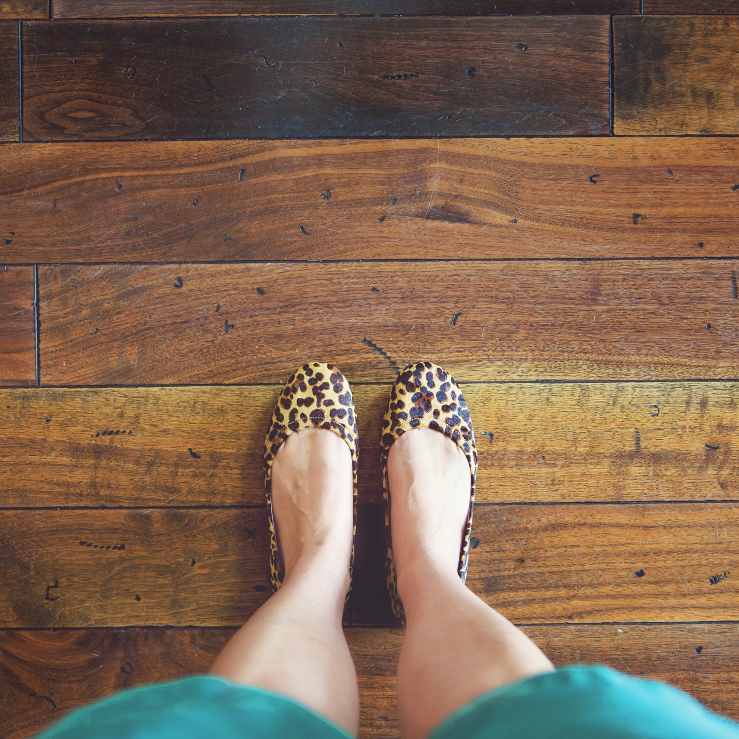 Standing on a hardwood floor in a home