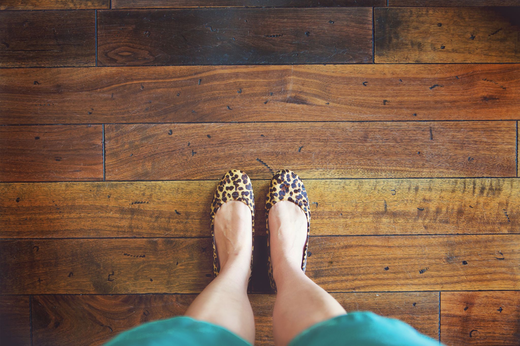 Standing on a hardwood floor in a home