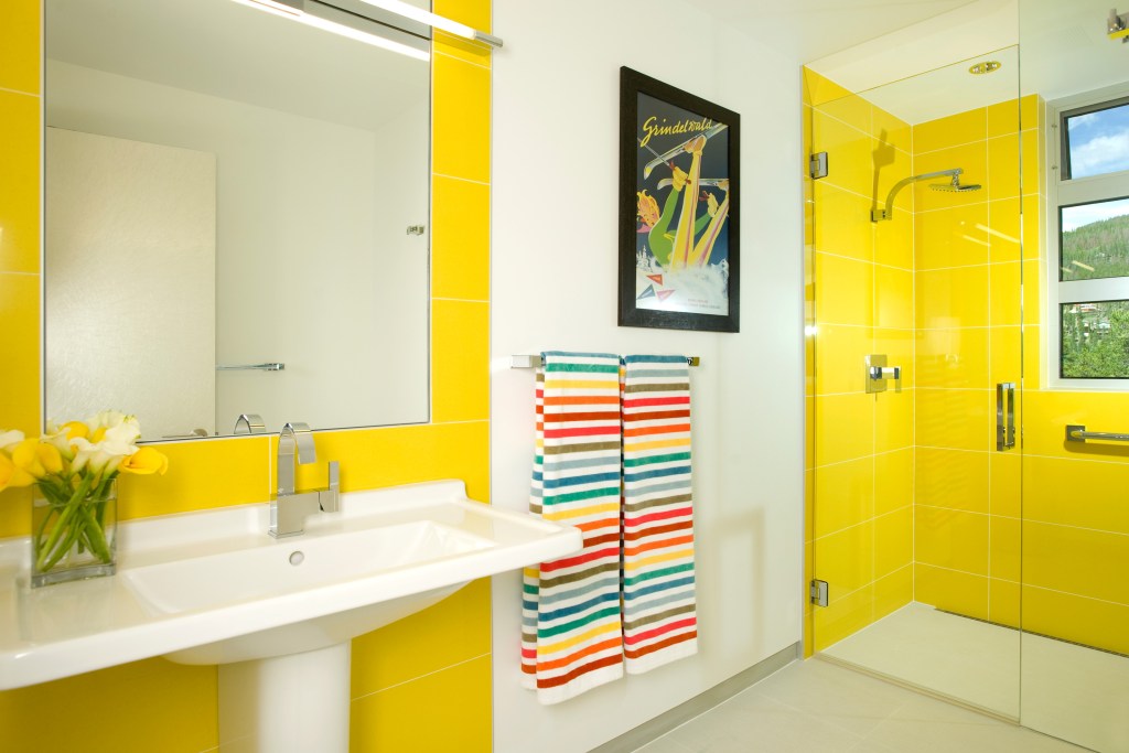 Yellow bathroom with walk-in shower