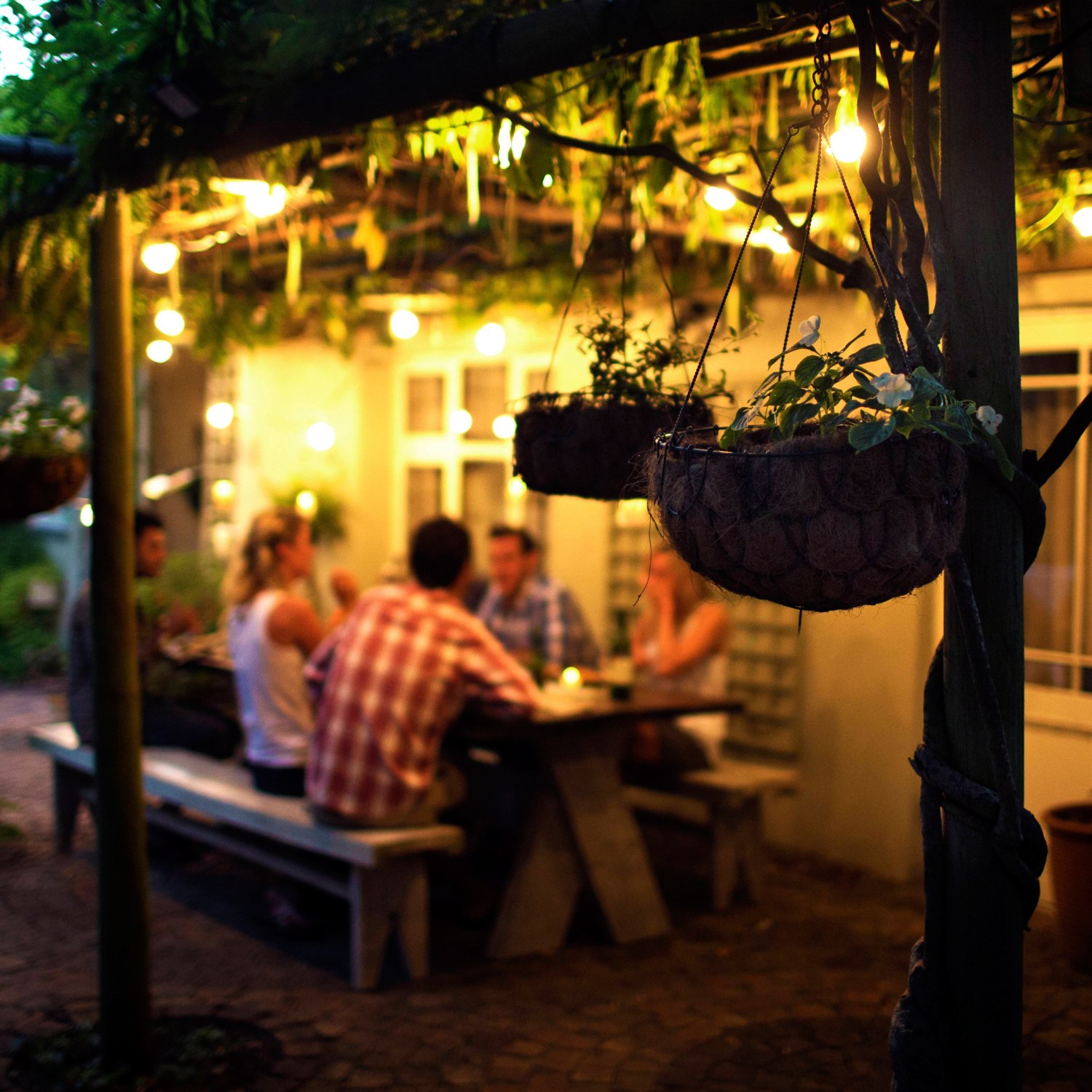 Homeowners entertaining on their porch