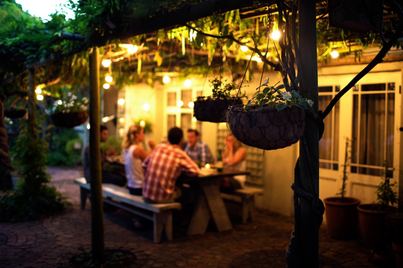 Homeowners entertaining on their porch