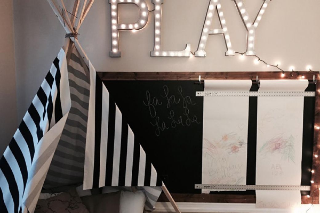 Chalkboard and paper rolls in a child's playroom