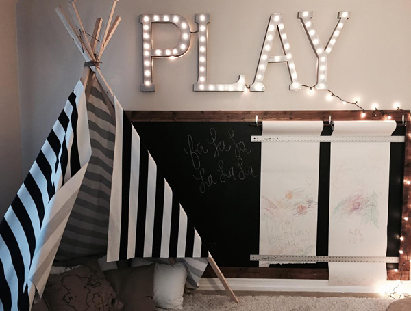 Chalkboard and paper rolls in a child's playroom