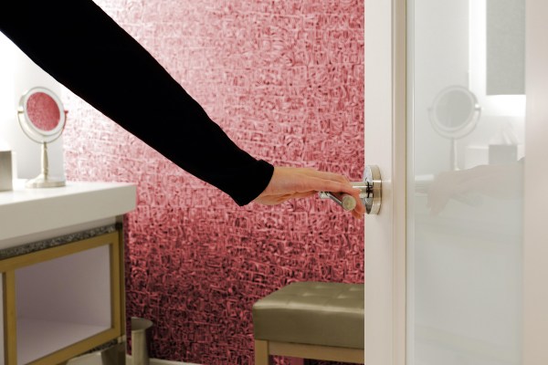 Opening a bathroom door at an open house
