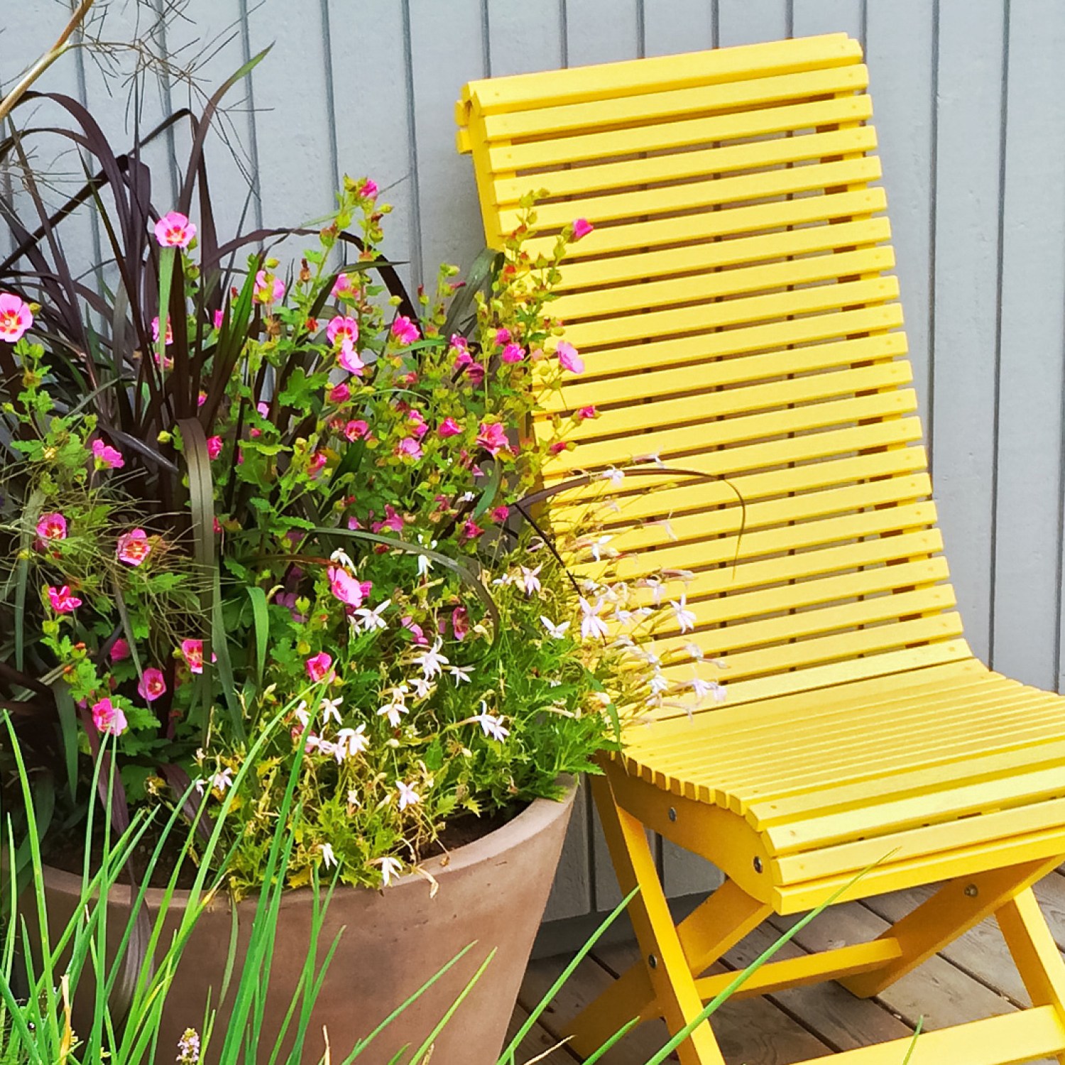 Yellow chair with potted plant