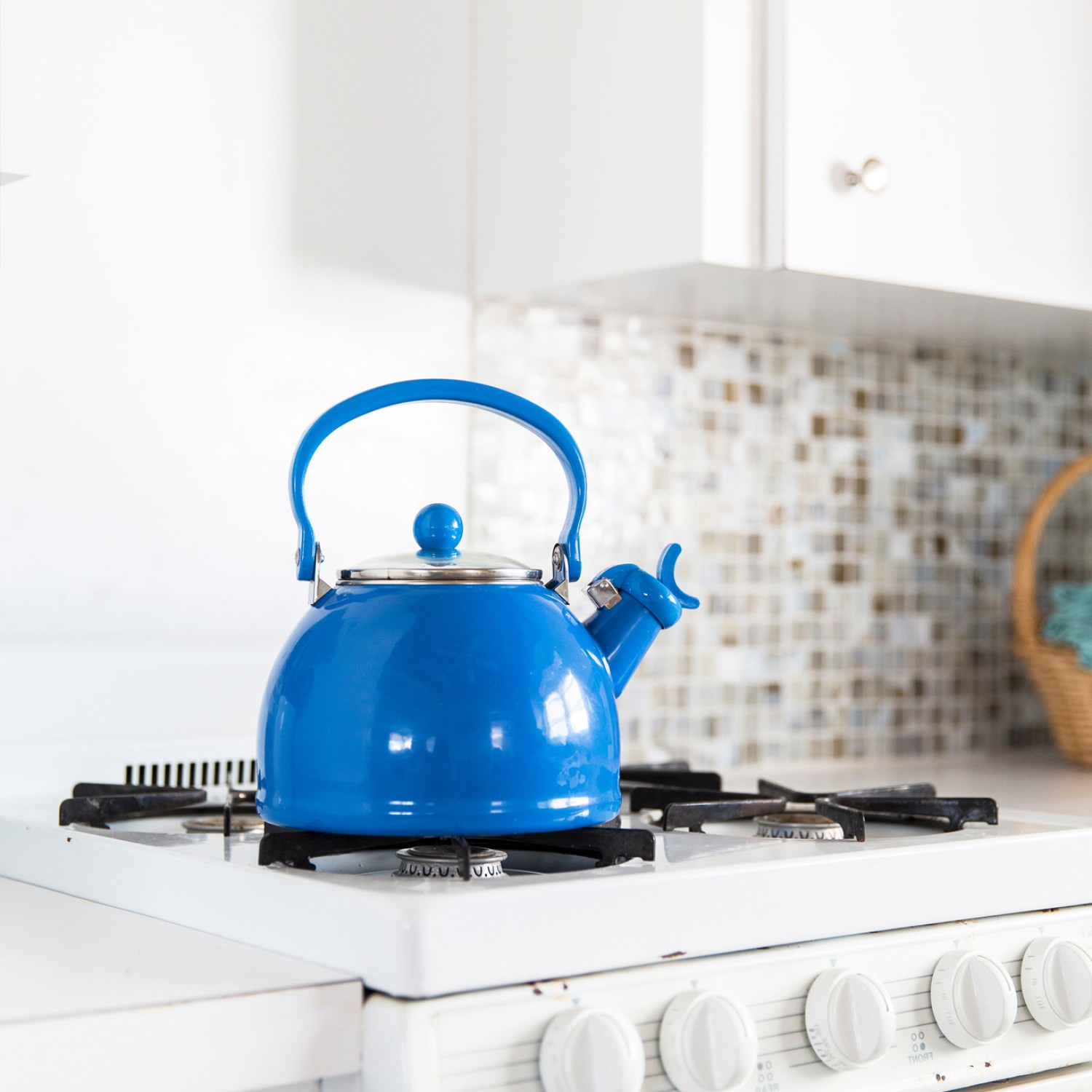 Blue tea kettle in a kitchen