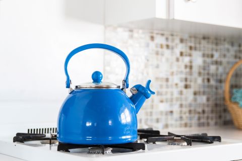 Blue tea kettle in a kitchen