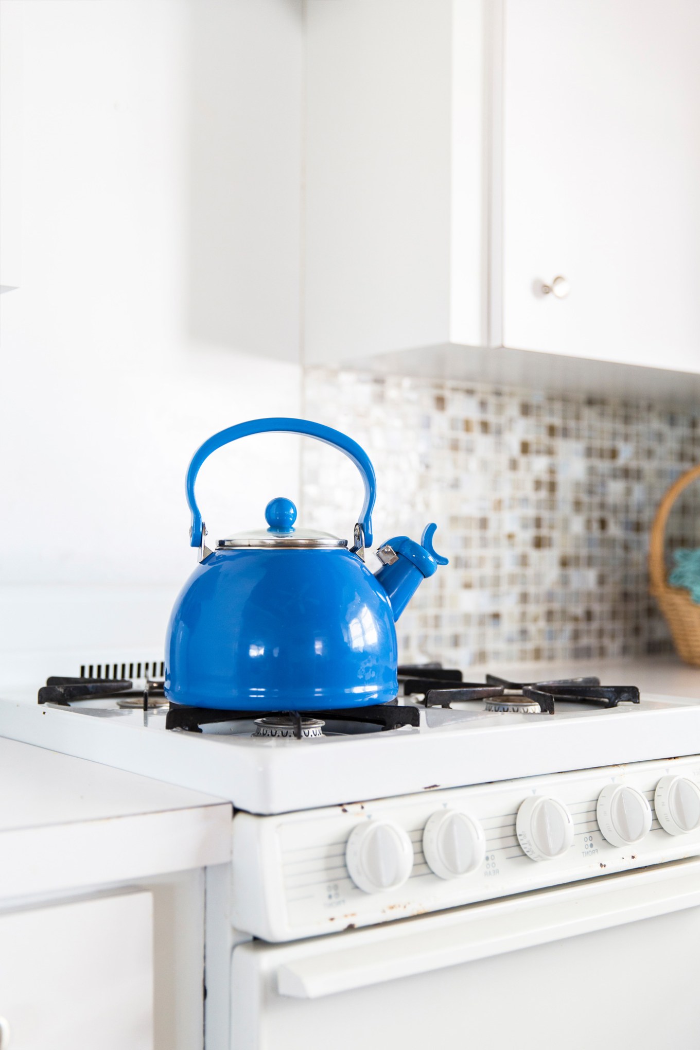 Blue tea kettle in a kitchen