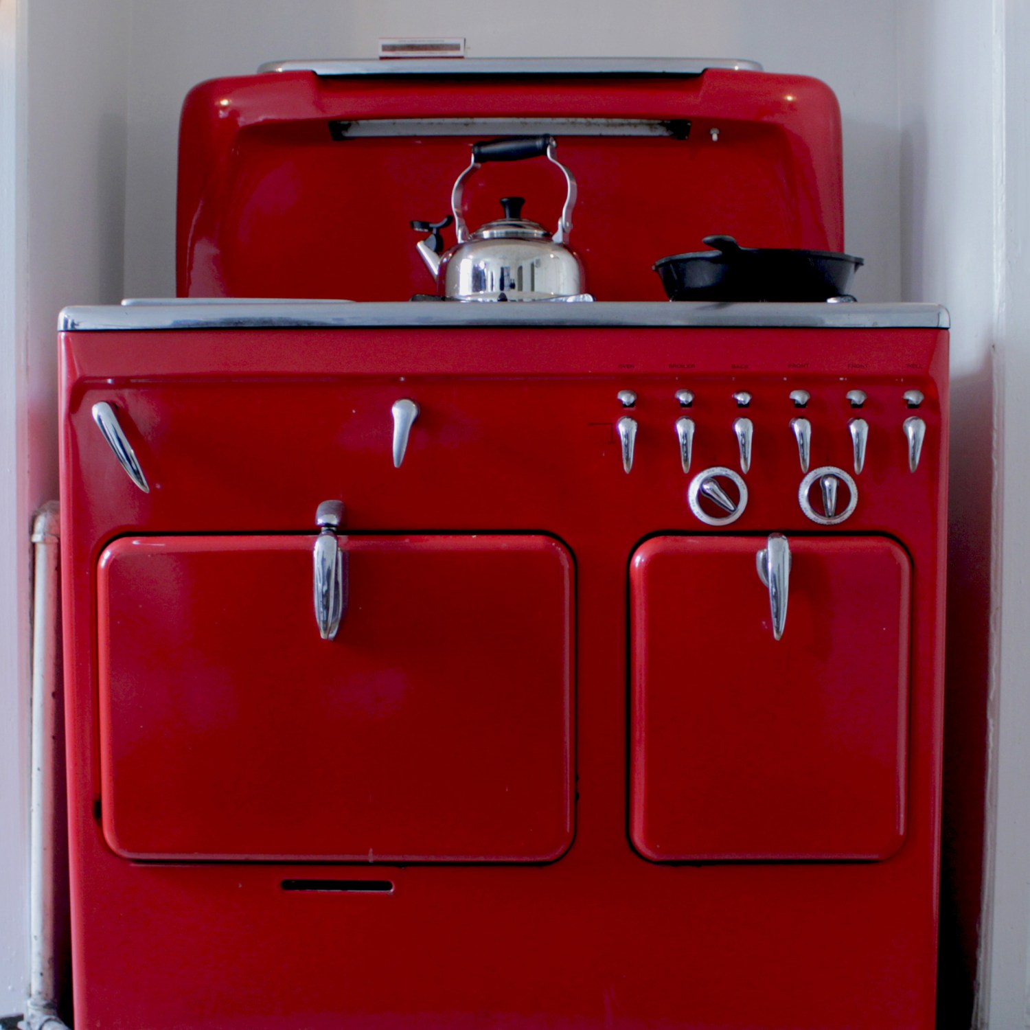 Red vintage stove in a home kitchen