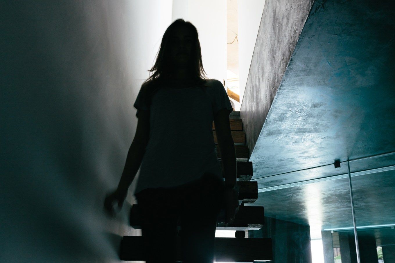 Woman walking up the basement stairs