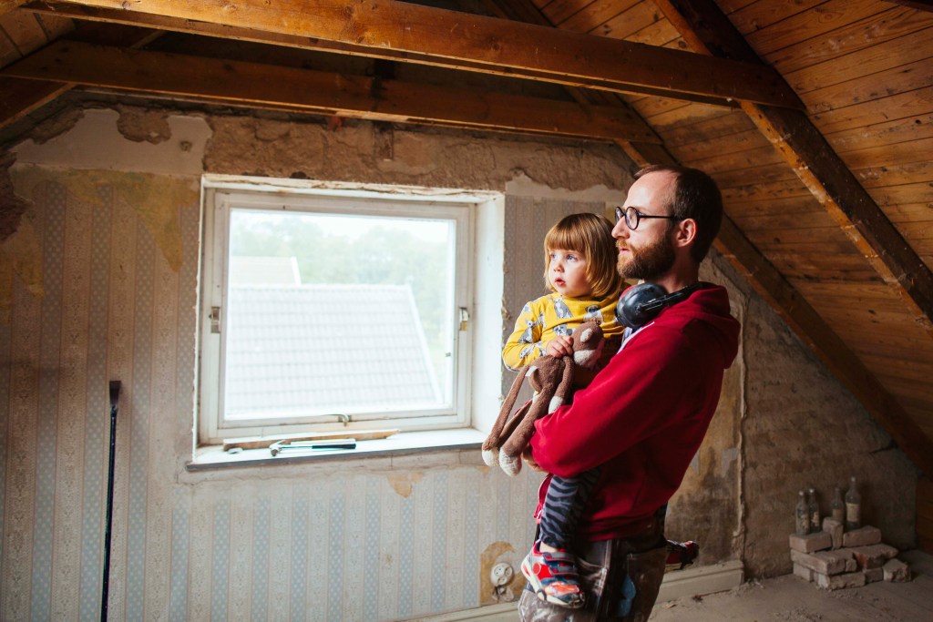Man and daughter in an unrenovated room