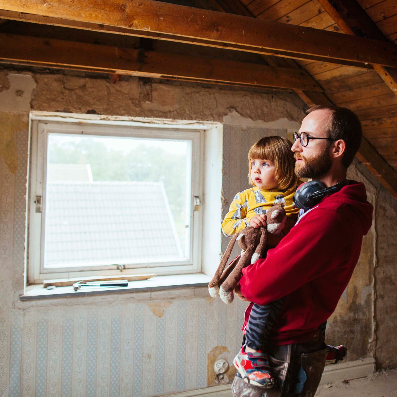 Man and daughter in an unrenovated room