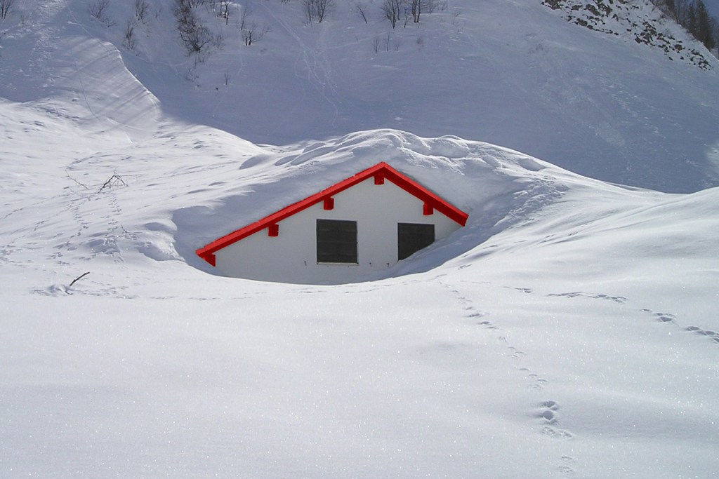 Home buried in snow