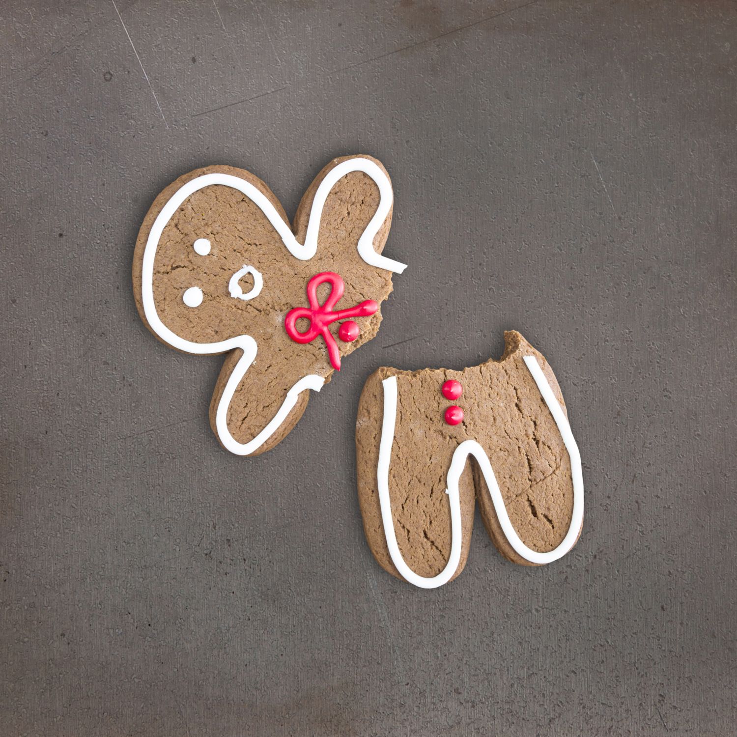 Broken gingerbread cookie on baking tray