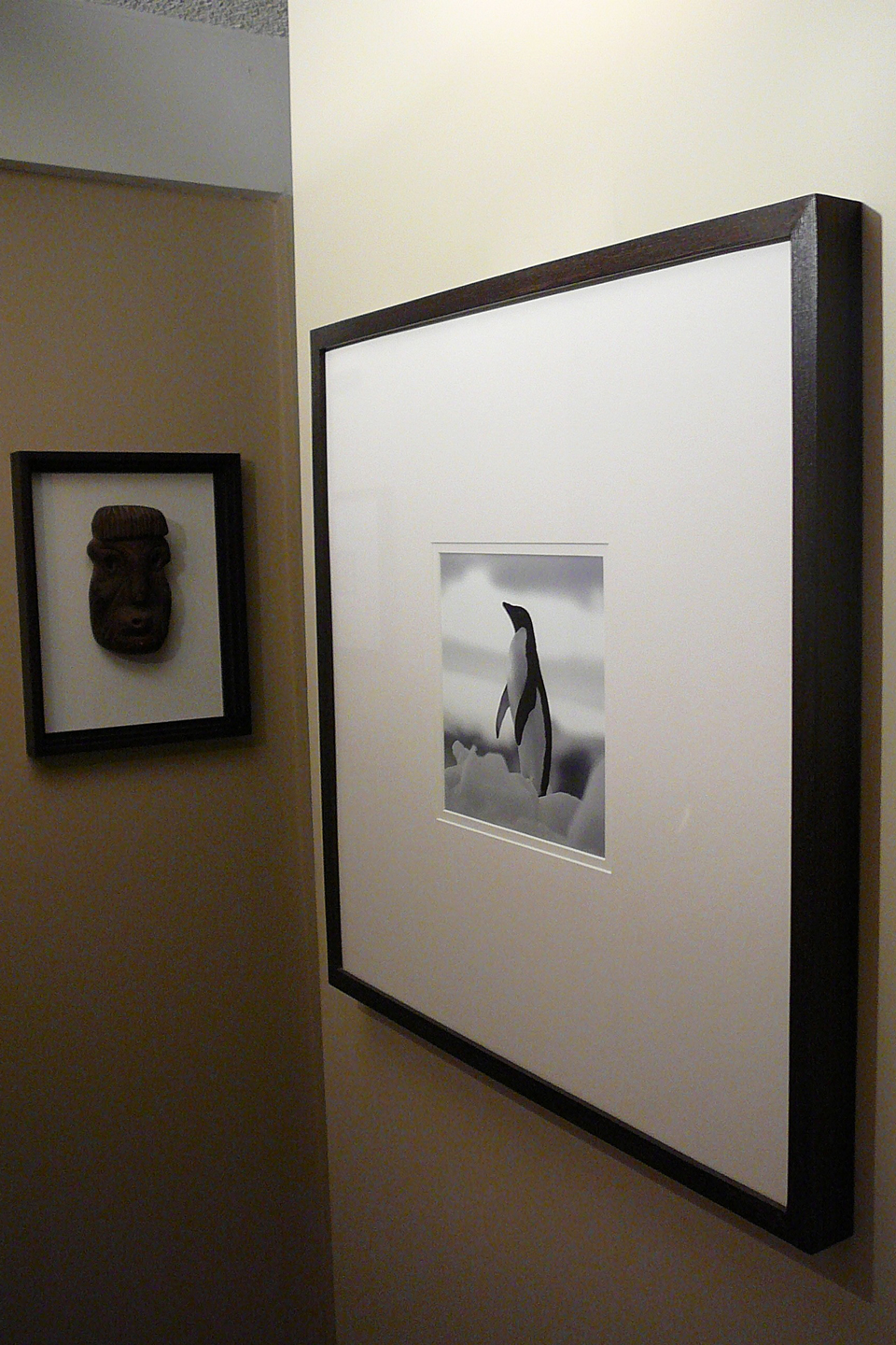 Utility box covered by a photograph on the wall