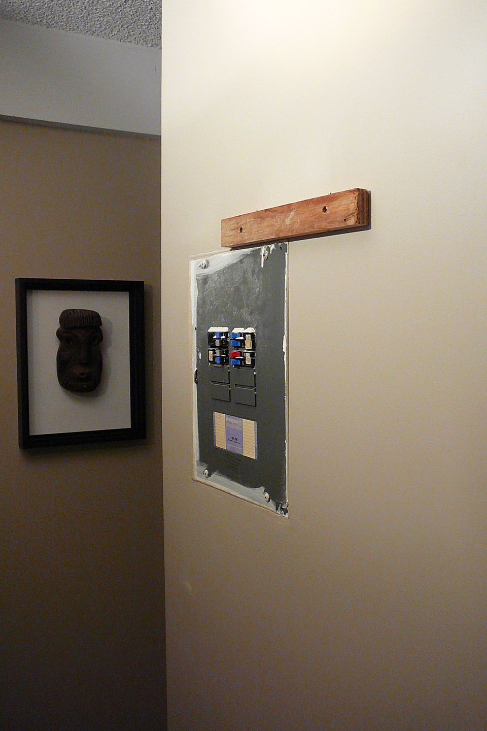 Utility box on a living room wall