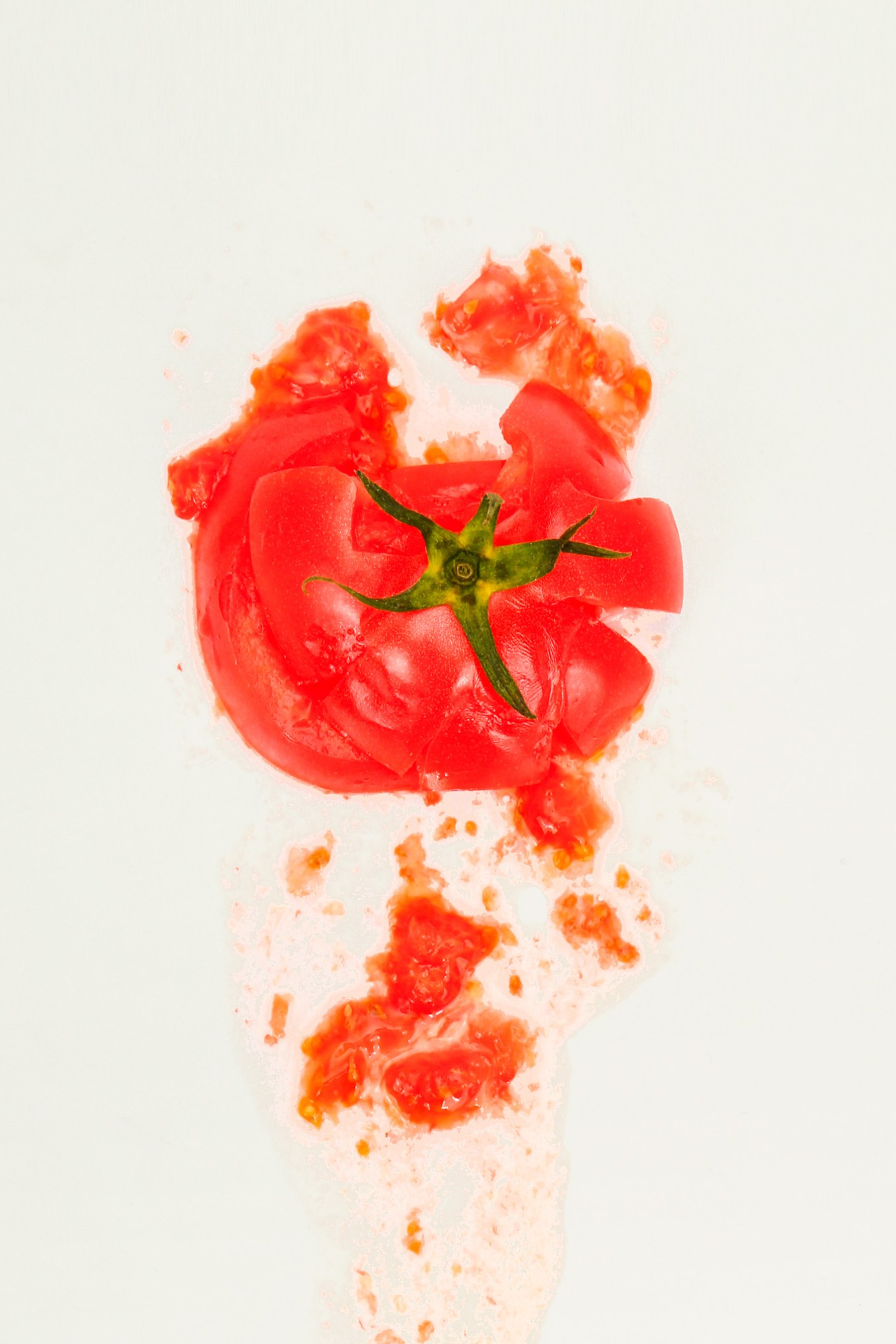 Tomato splatted against a kitchen wall