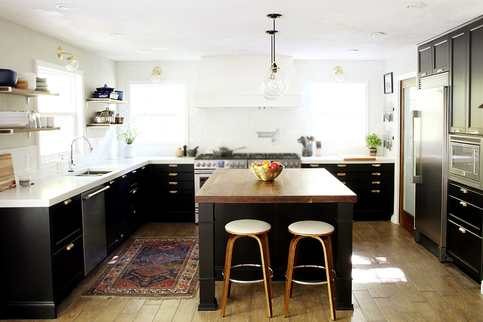 Updated kitchen with black cabinets, white countertops