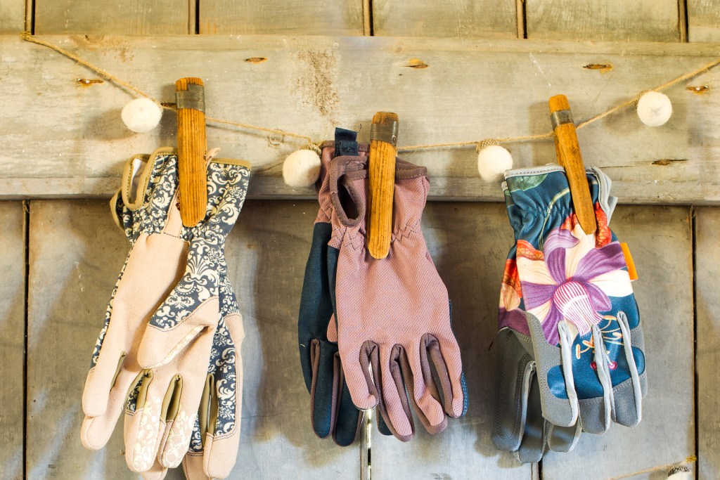 Garden gloves stored on line with clothespins