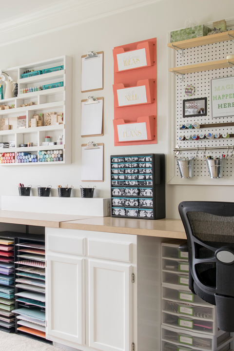 Tidy bright craft room with pegboard organization