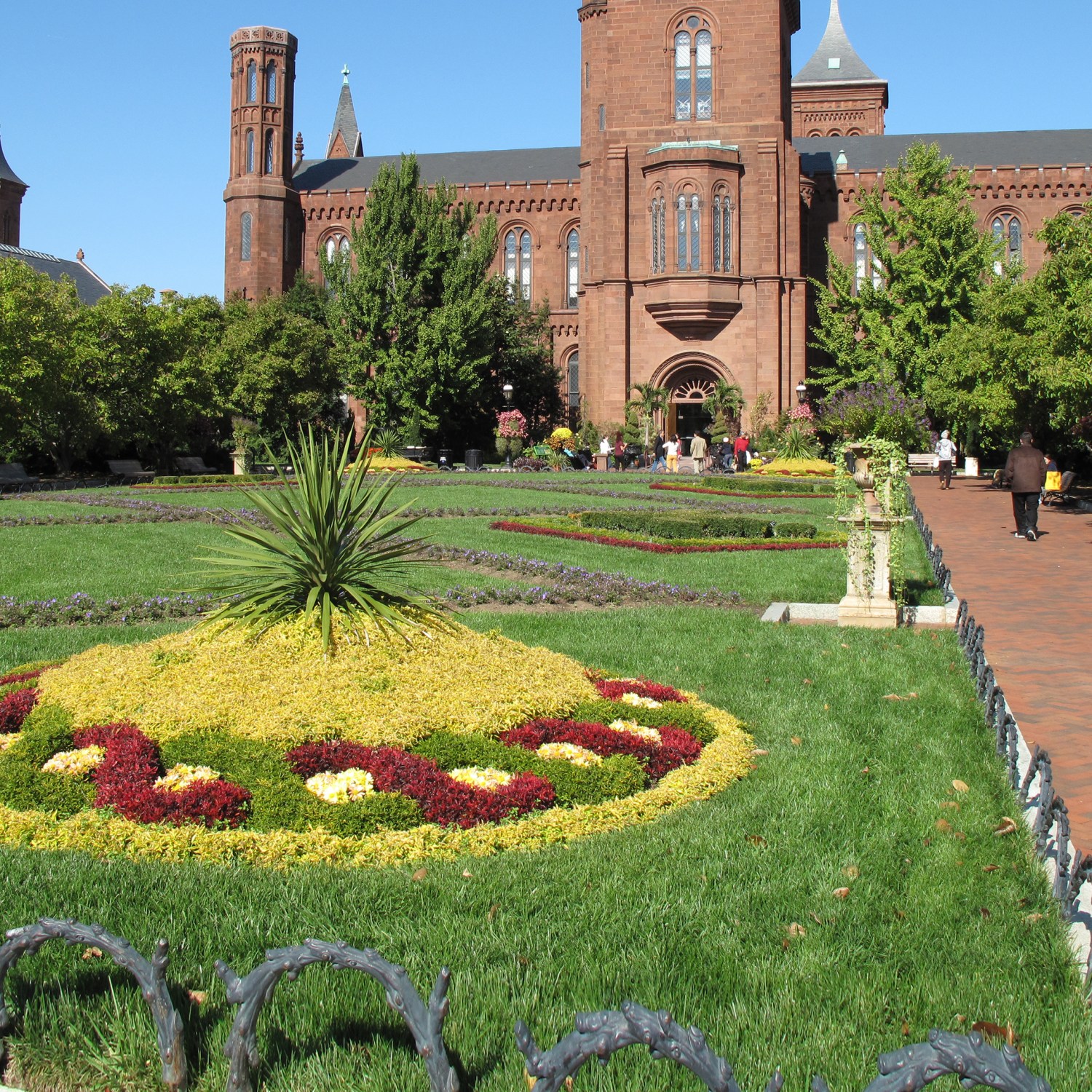 Lush green grass in front of the Smithsonian Castle