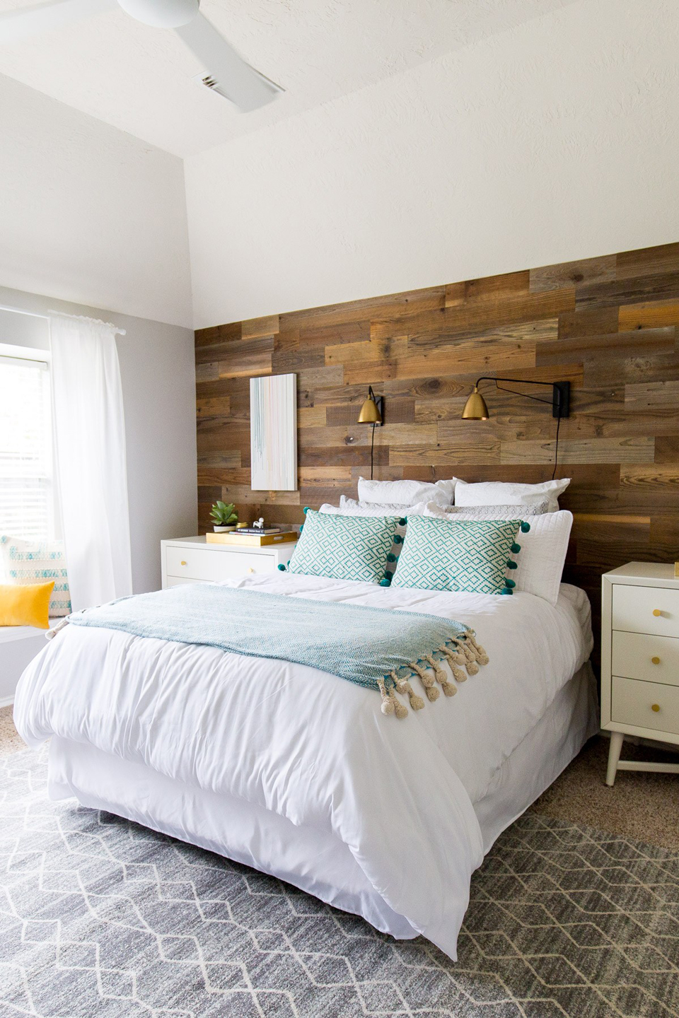 An after image a of a bright bedroom with DIY wood panel