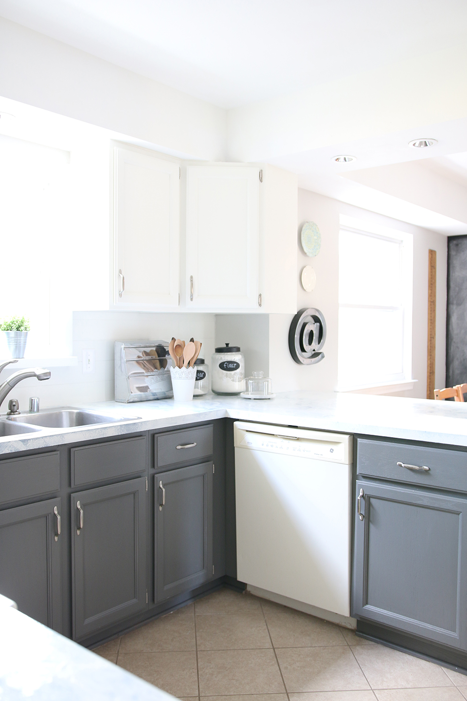 An after image of a bright with kitchen with gray cabinets