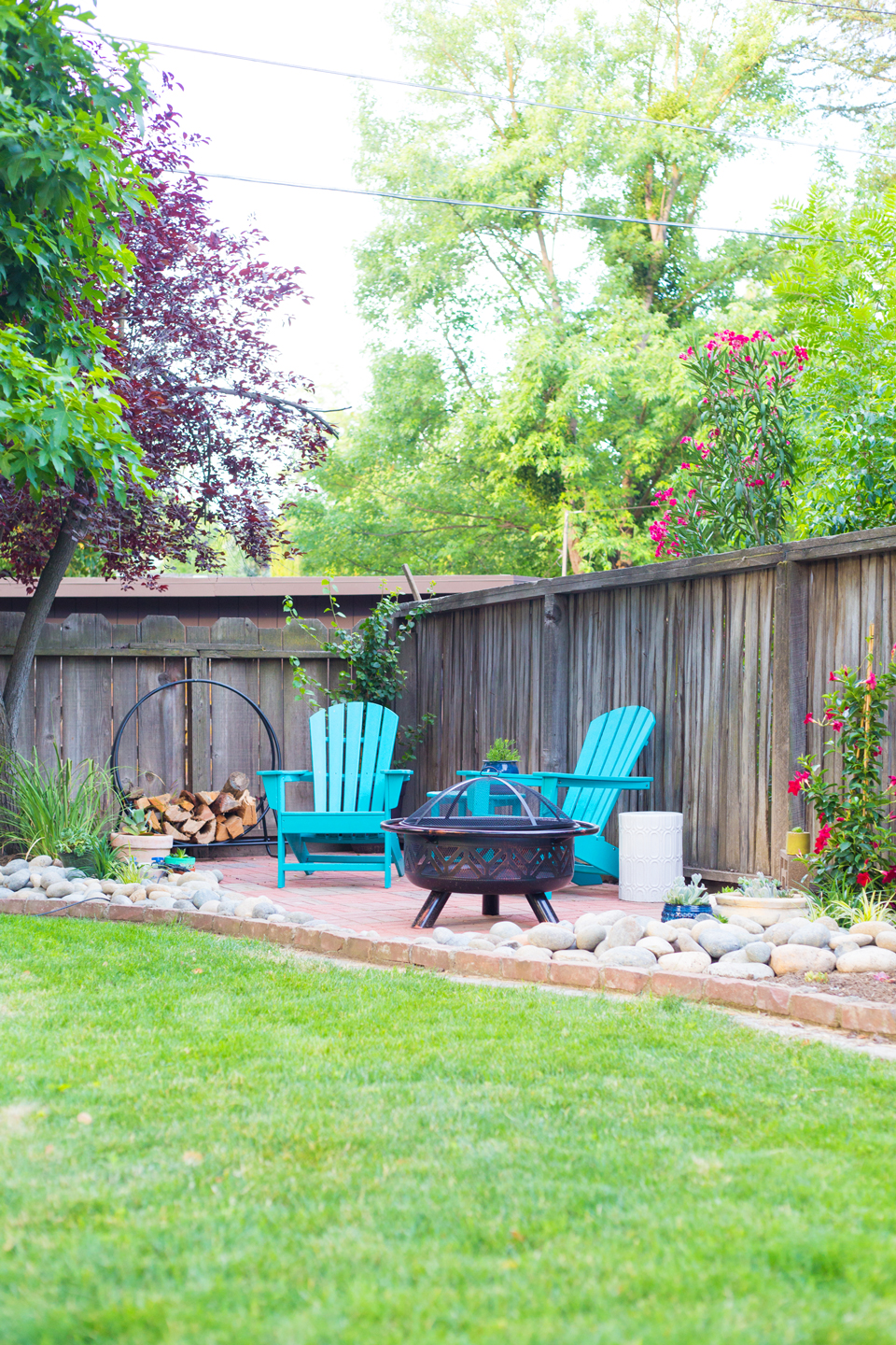 An after image of a backyard patio with firepit