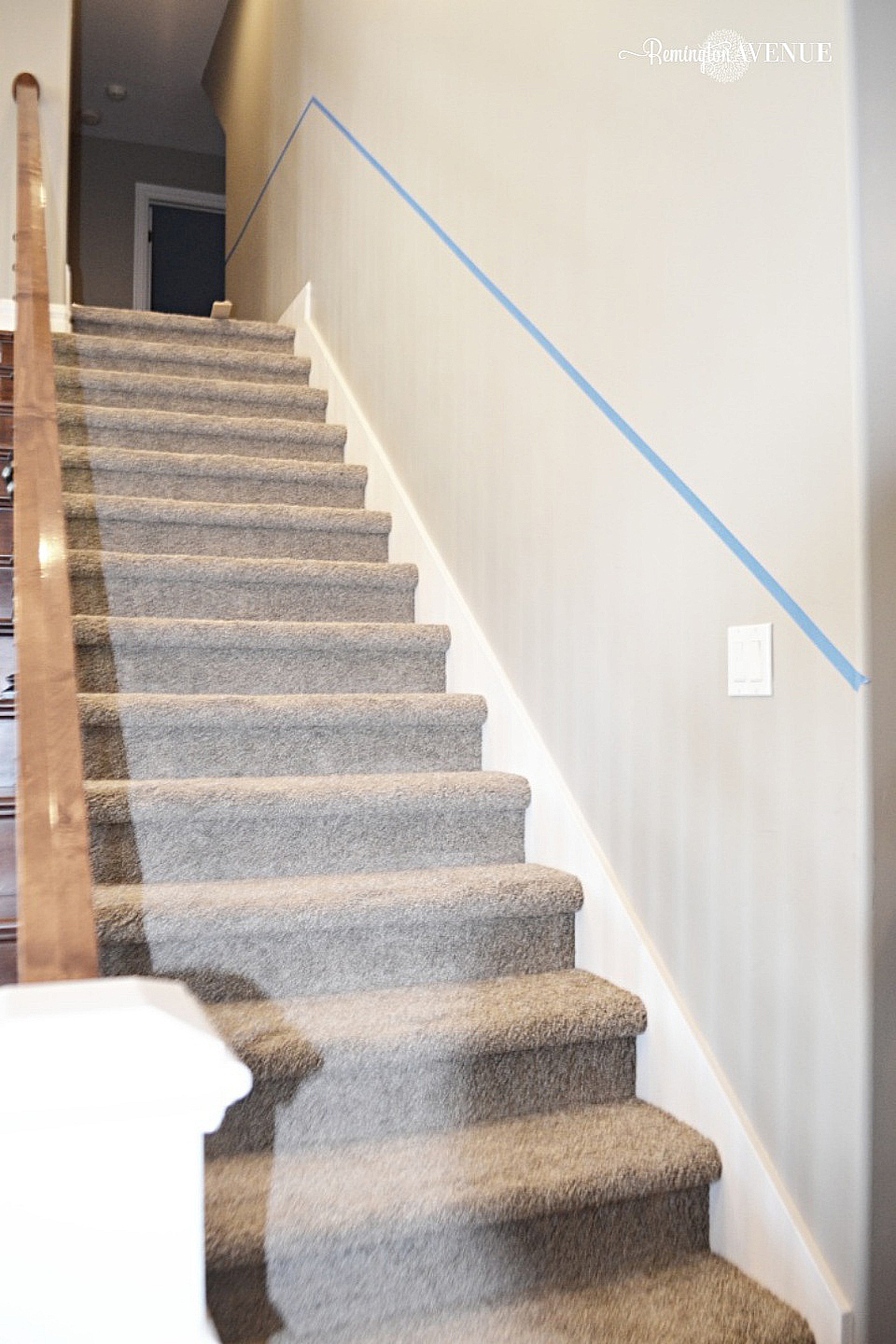 A before image of a carpeted staircase
