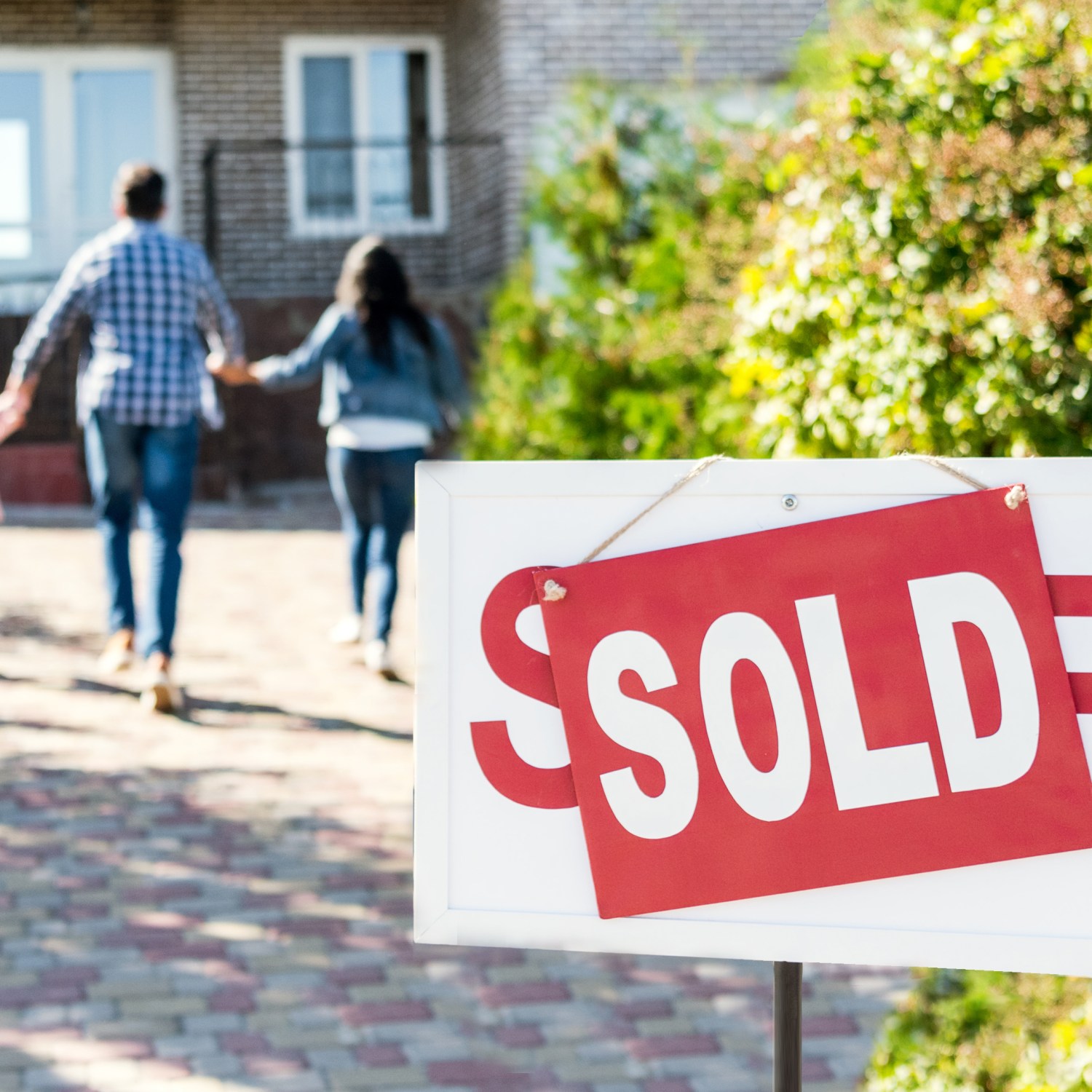 Sold sign in front of a home